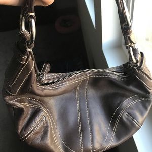 Coach mini purse in brown color.